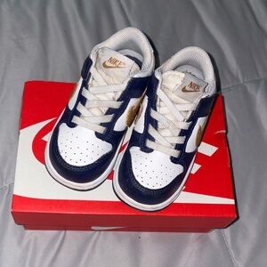 Nike Kids' Blue and White Sneakers with Gold Accents